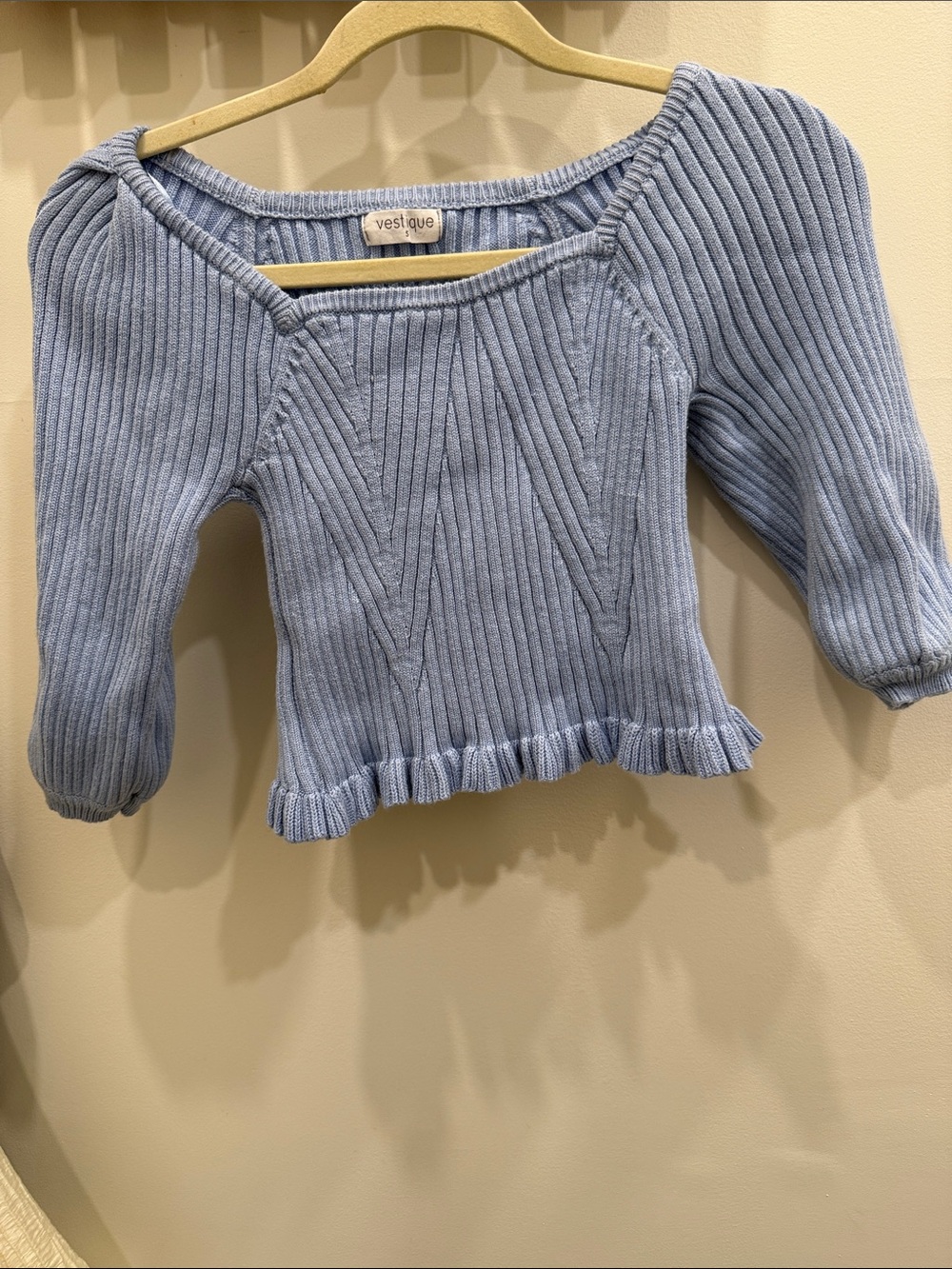vestique Pastel Blue Ribbed Off-Shoulder Sweater with Ruffle Hem
